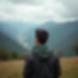 A person contemplating their career options amidst a scenic background.